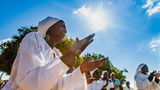 Nuns singing and clapping in choir